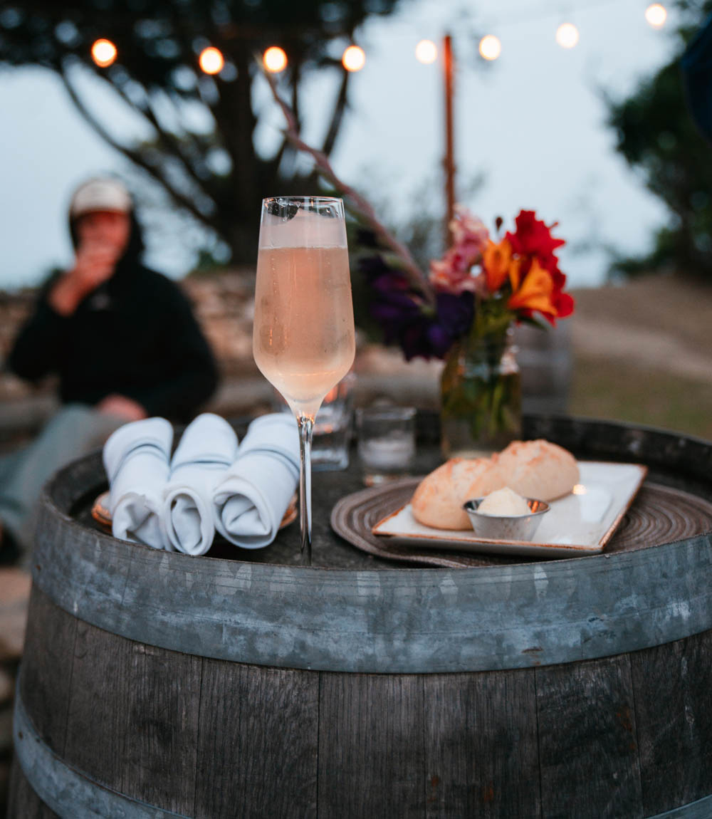 glass of champagne at night on the patio